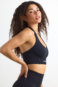 Define Luxe Halterneck Sports Bra in Jet Black sold by Oh Polly