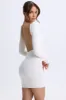 Open-Back Bodycon Mini Dress in White sold by Oh Polly