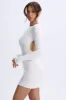 Open-Back Bodycon Mini Dress in White sold by Oh Polly