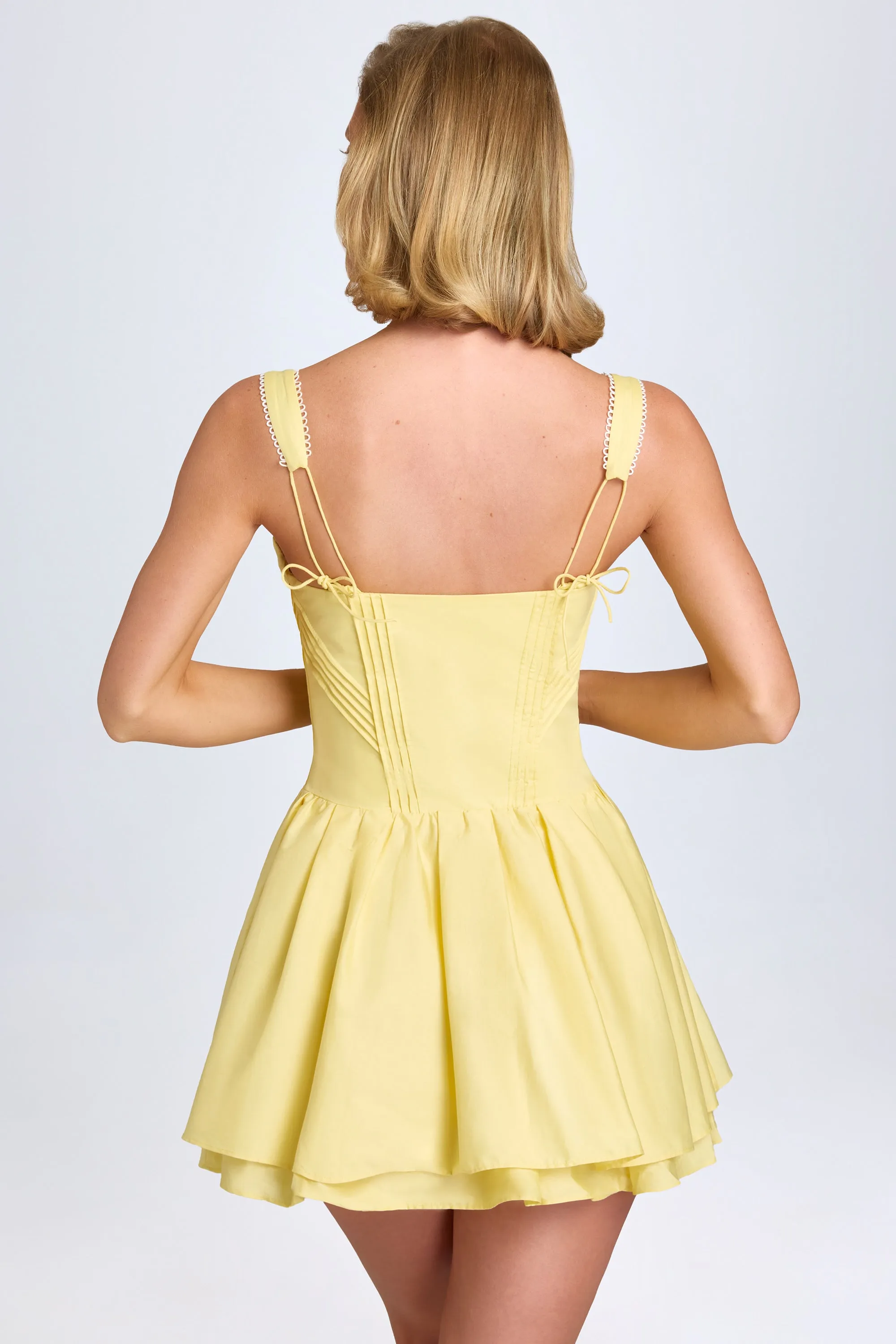 Pintucked Lace-Up Corset Mini Dress in Pastel Yellow sold by Oh Polly product image thumbnail 3