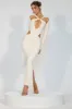 Premium Jersey Long Sleeve Cut Out Maxi Dress in Ivory sold by Oh Polly