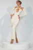 Premium Jersey Long Sleeve Cut Out Maxi Dress in Ivory sold by Oh Polly