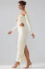 Premium Jersey Long Sleeve Cut Out Maxi Dress in Ivory sold by Oh Polly
