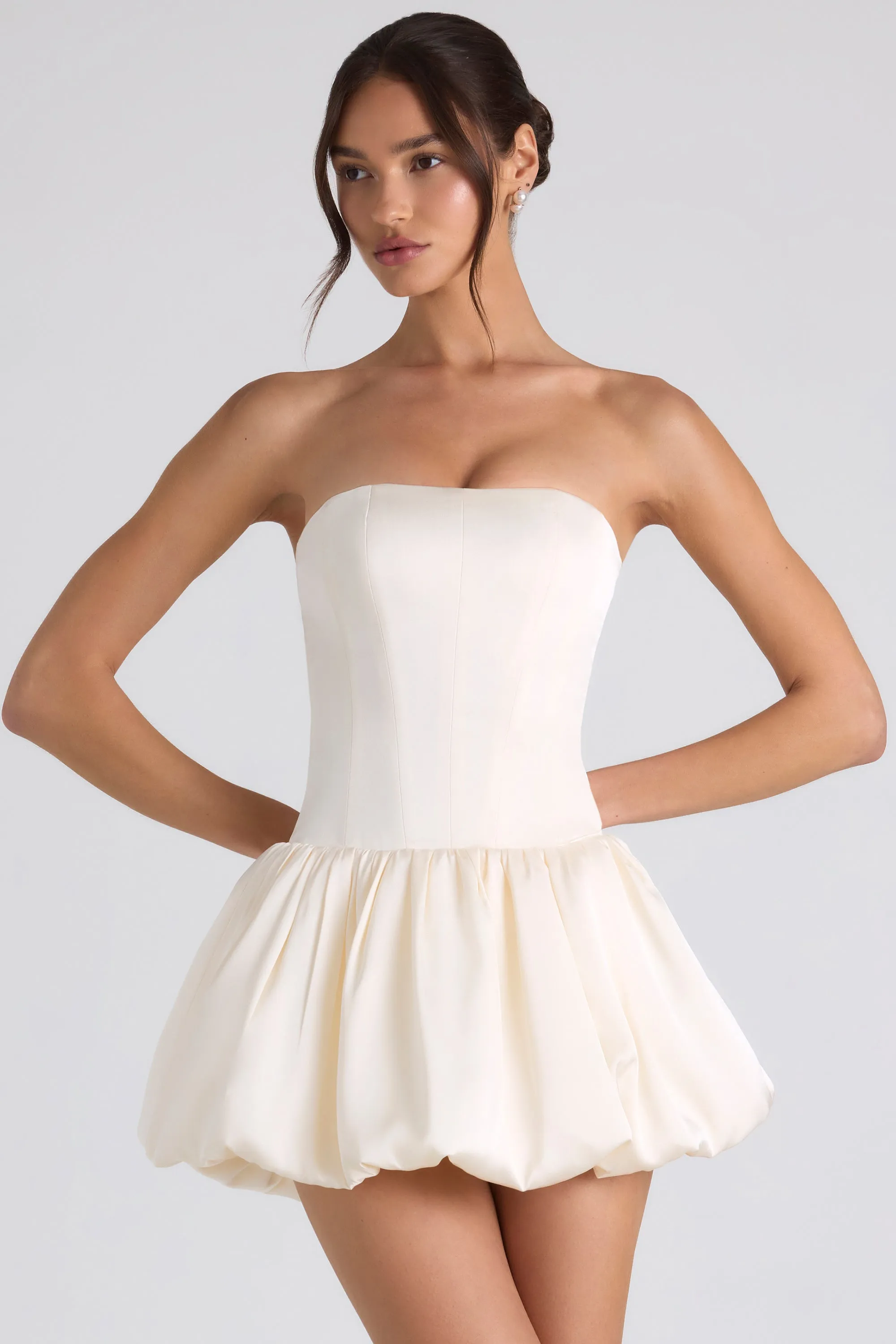 Lace-Up Bubble Hem Corset Mini Dress in Ivory sold by Oh Polly