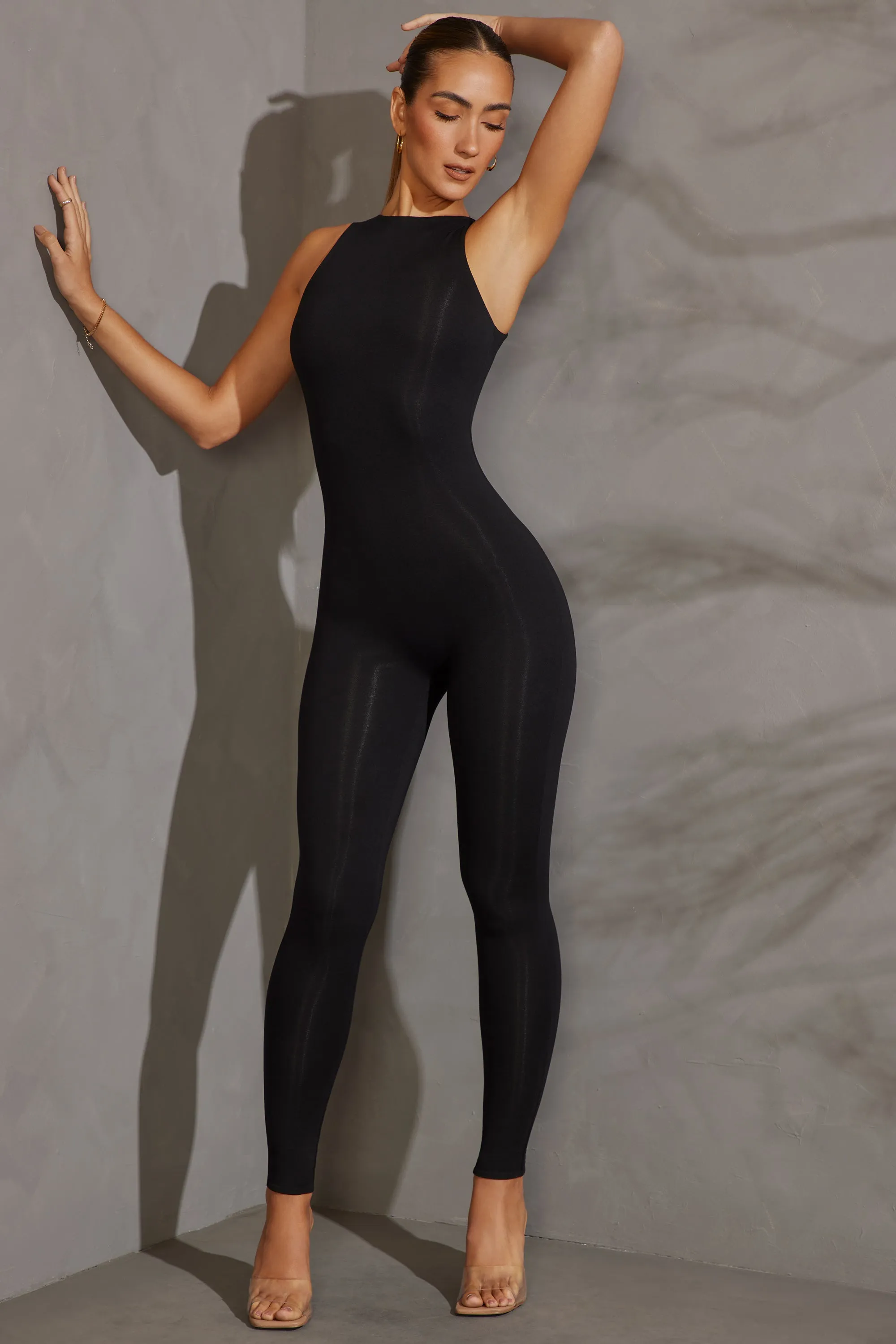 Racer Neck Jumpsuit in Black sold by Oh Polly