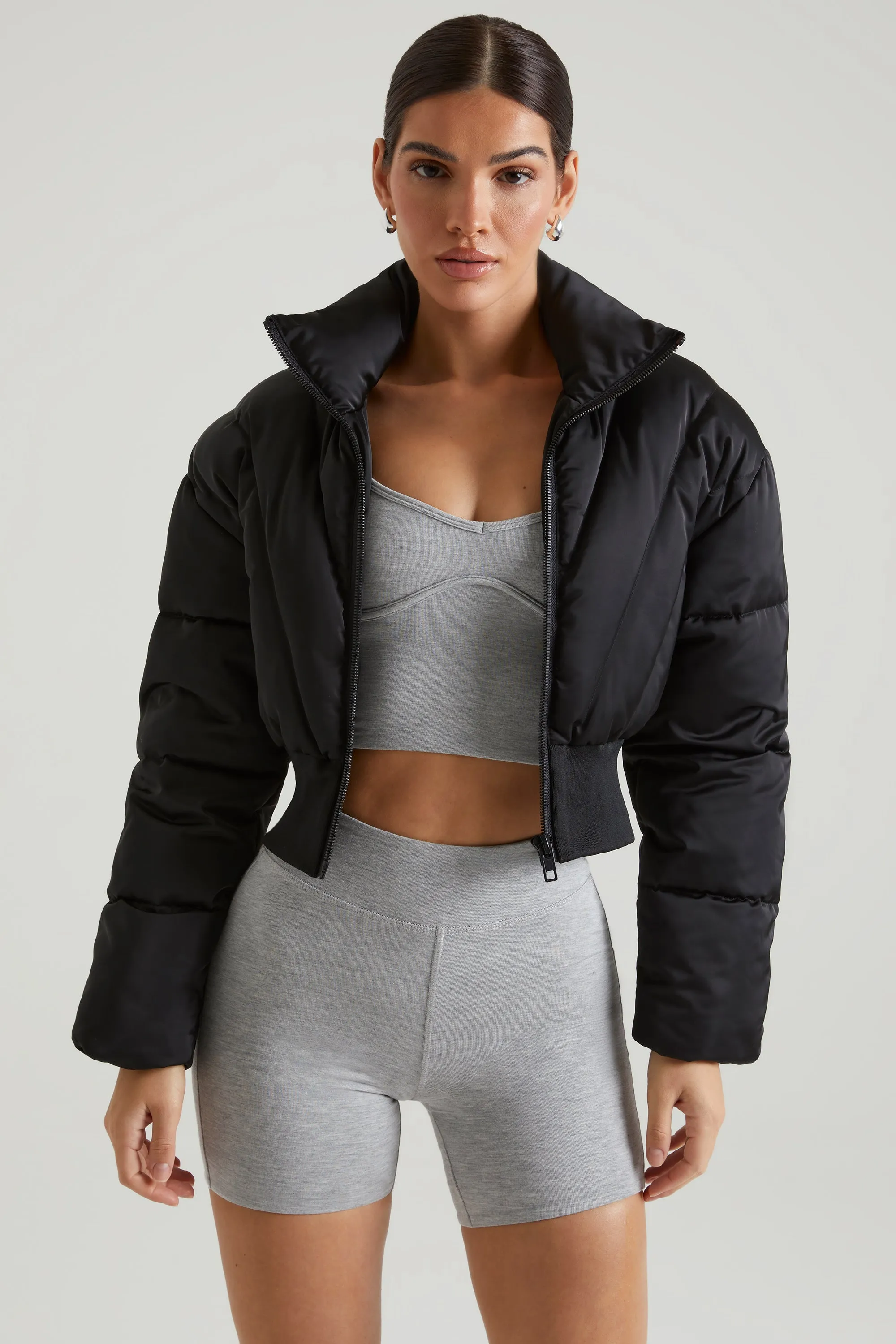 Ribbed Puffer Jacket in Black sold by Oh Polly