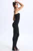 Petite Twist-Front Split Hem Flared Jumpsuit in Black sold by Oh Polly