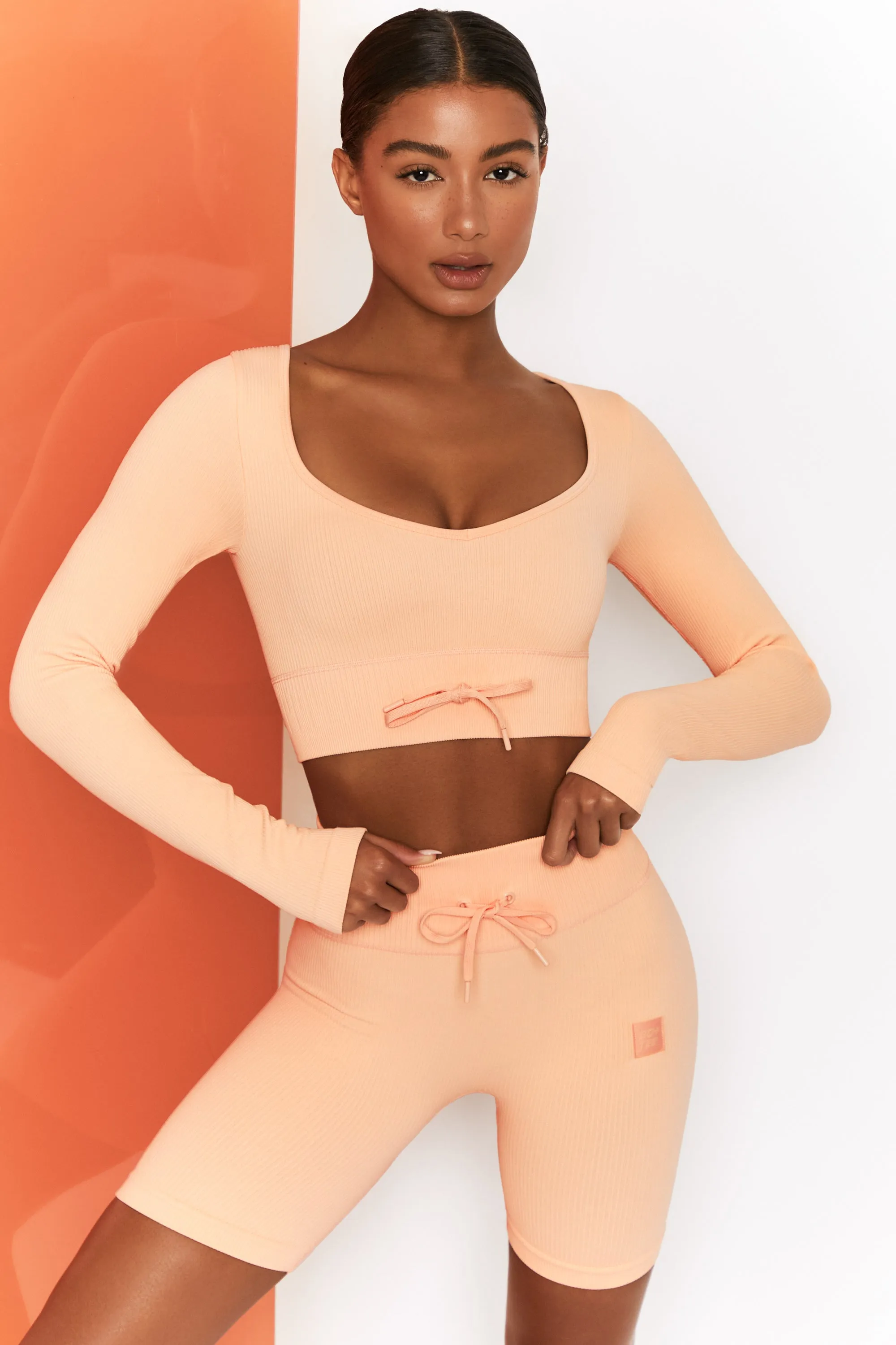 Time Check Ribbed Long Sleeve Crop Top in Peach sold by Oh Polly