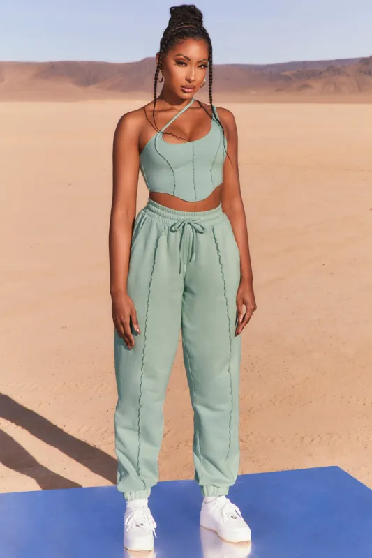 Exposed Seam Asymmetric Crop Top in Blue sold by Oh Polly