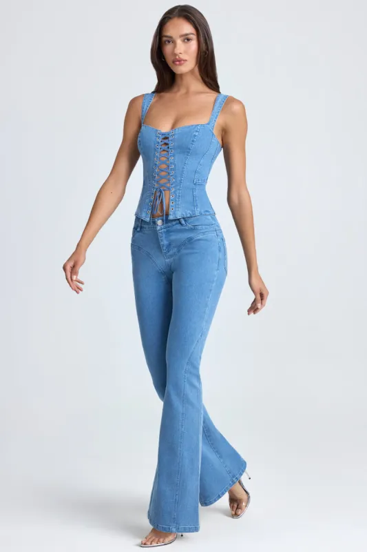 Petite Mid-Rise Flared Jeans in Mid Blue Stonewash made by Oh Polly