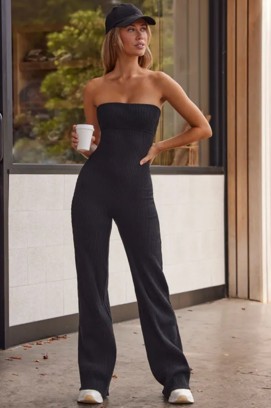 Petite Soft Rib Bandeau Flare Jumpsuit in Black sold by Oh Polly