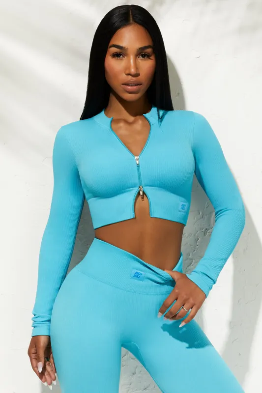 Long Sleeve Zip Crop Top in Blue sold by Oh Polly