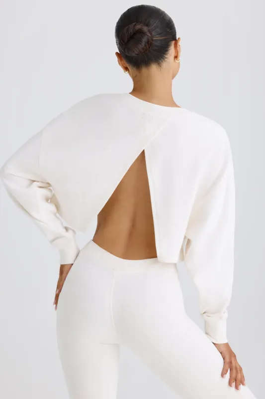 Crew-Neck Open-Back Cropped Sweatshirt in White sold by Oh Polly