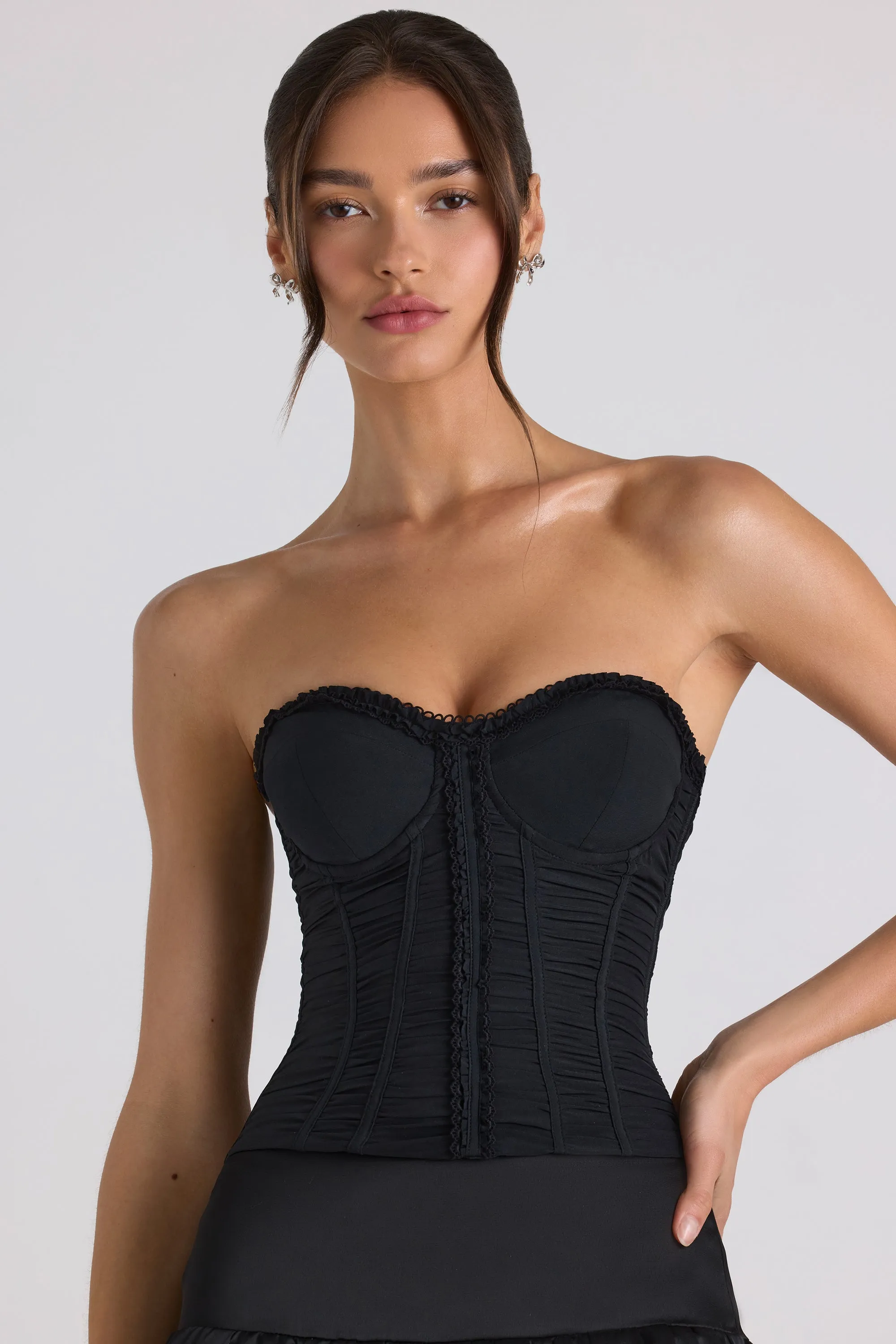 Ruched Lace-Up Strapless Corset Top in Black sold by Oh Polly
