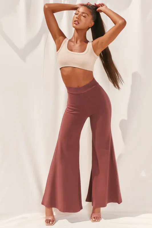 Cutting A Fine Figure Flared Trousers in Chocolate Brown sold by Oh Polly