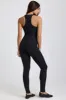 Petite Ribbed Modal Lace-Trim Jumpsuit in Black sold by Oh Polly