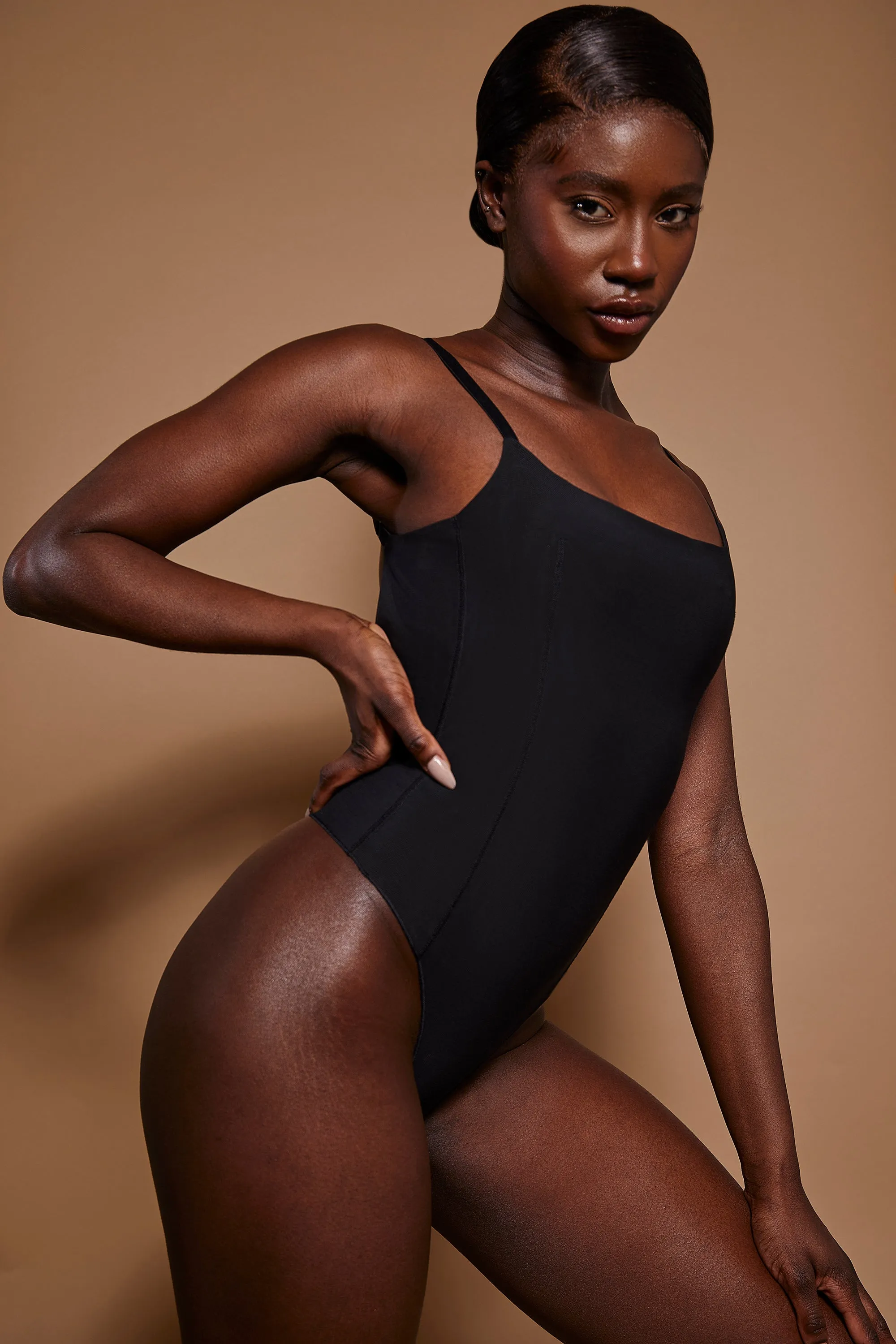 Soft Mesh Bodysuit in Black sold by Oh Polly