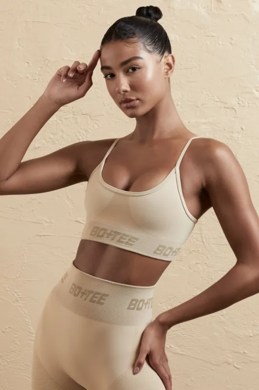 Curved Neckline Sports Bra in Beige sold by Oh Polly