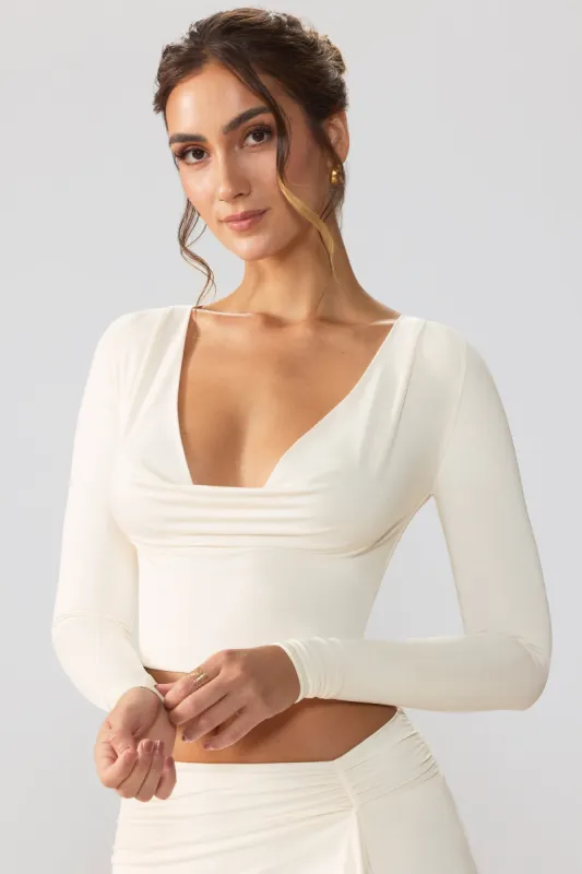 Slinky Jersey Plunge Neck Long Sleeve Crop Top Top in Ivory sold by Oh Polly