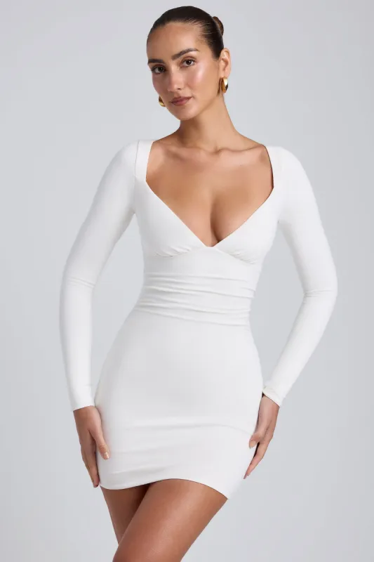 Modal Ruched Long-Sleeve Mini Dress in White sold by Oh Polly