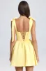 Draped Corset Mini Dress in Lemon Sherbet sold by Oh Polly
