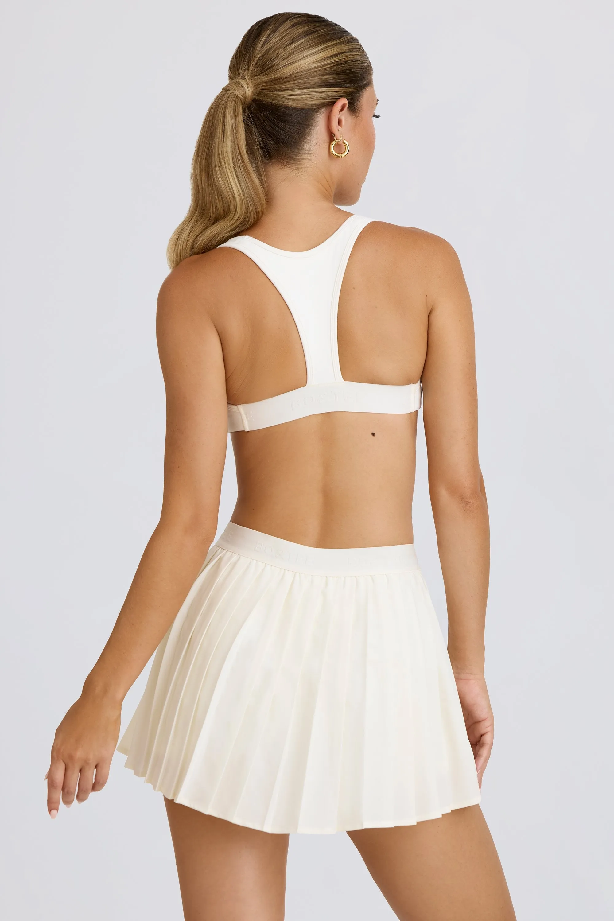 Pleated Tennis Skirt in White sold by Oh Polly product image thumbnail 2