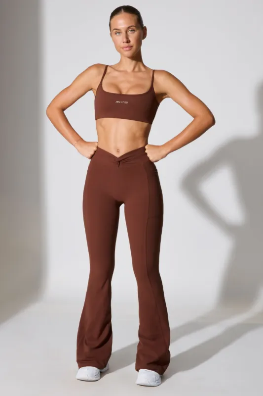 Petite Twist Waist Flare Leggings in Chocolate sold by Oh Polly