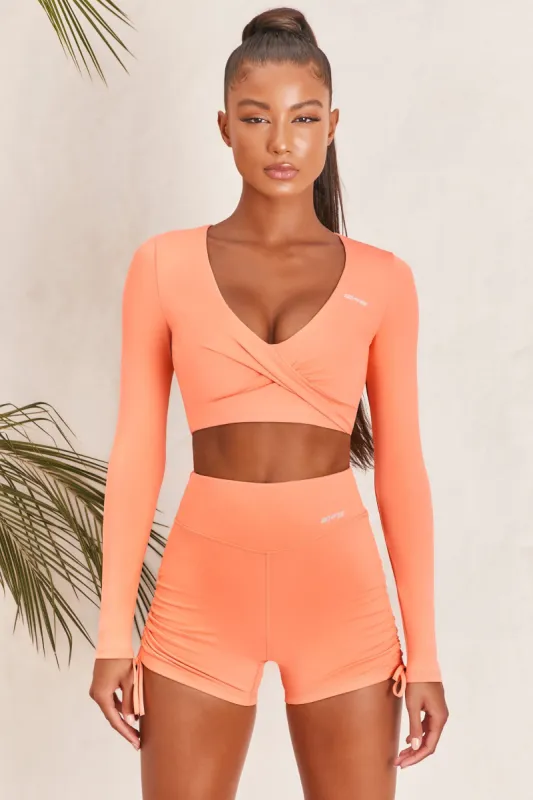 Progress Slinky Long Sleeve Crop Top in Orange sold by Oh Polly