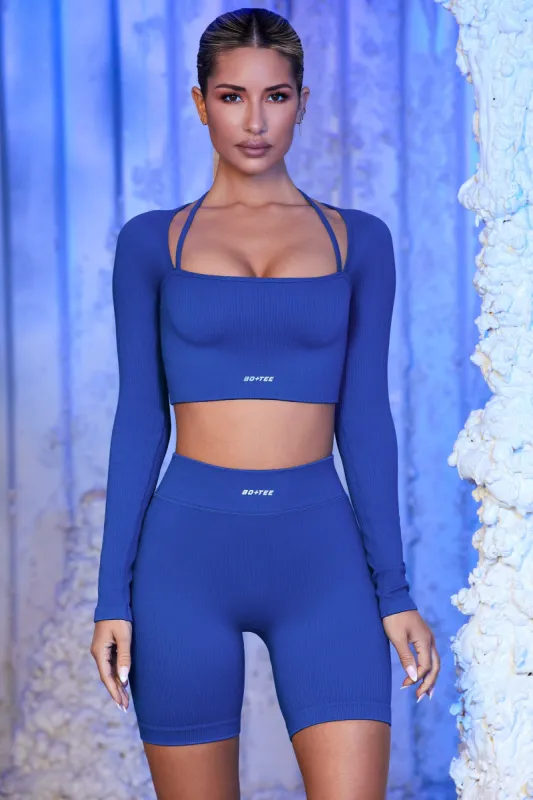 Strap Detail Long Sleeve Crop Top in Blue sold by Oh Polly