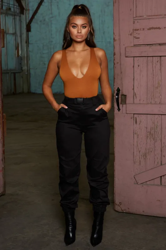 Reporting For Duty High Waisted Cargo Trousers in Black sold by Oh Polly