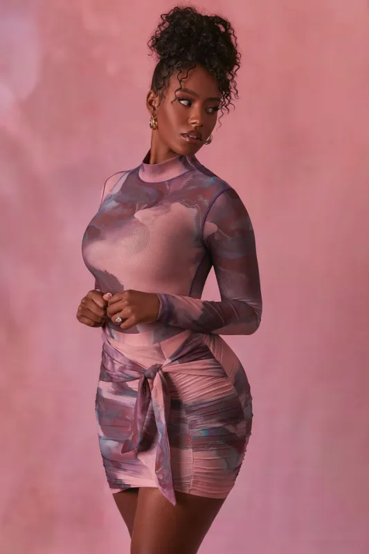 Wrap Front Ruched Mesh Mini Skirt in Blush sold by Oh Polly