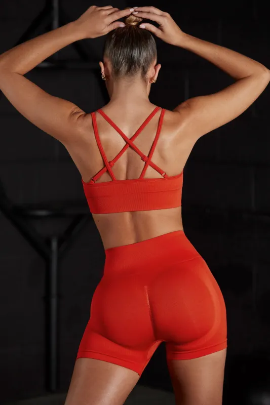 Seamless Strappy Sports Bra in Red sold by Oh Polly