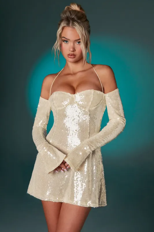 Off The Shoulder Sequin A-Line Mini Dress in Ivory sold by Oh Polly