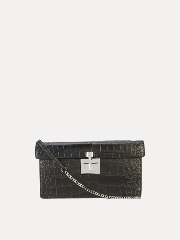 Alligator Alibi Clutch sold by Oscar de la Renta