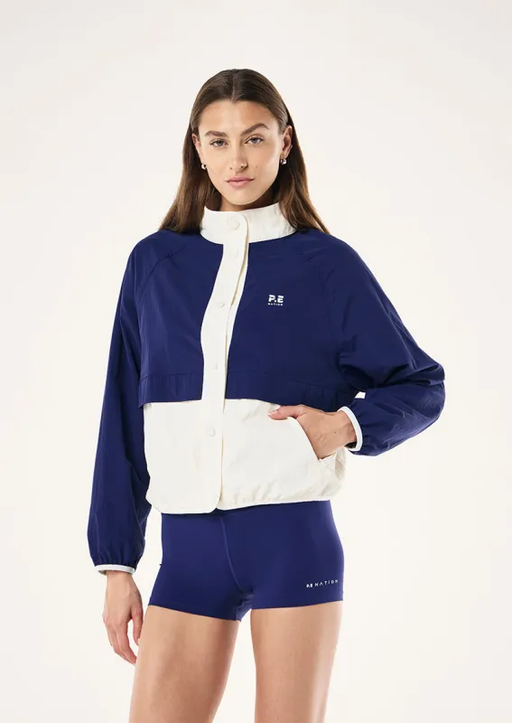 TECHNIQUE SPRAY JACKET IN BRIGHT NAVY sold by P.E Nation