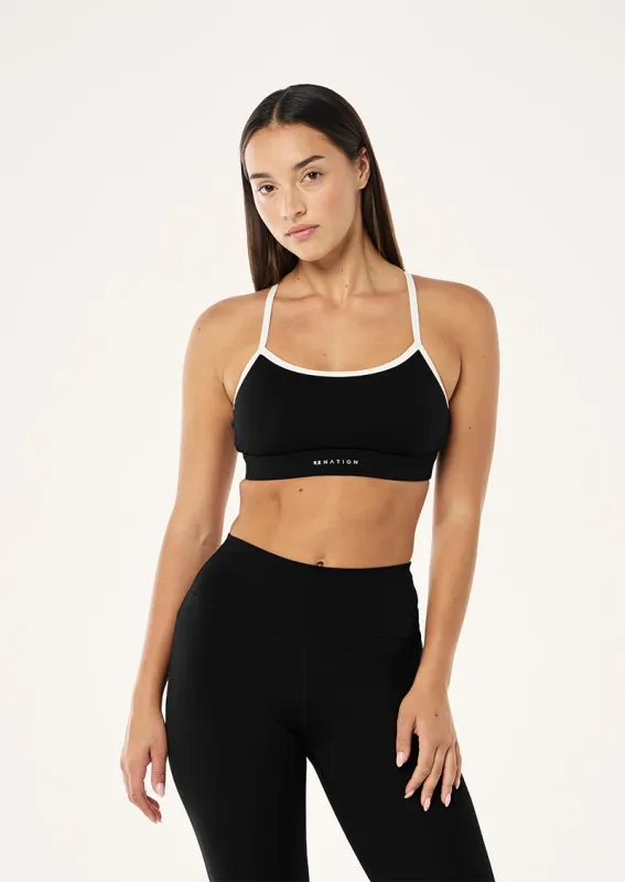 SIGNATURE SPORTS BRA IN BLACK & OPTIC WHITE made by P.E Nation
