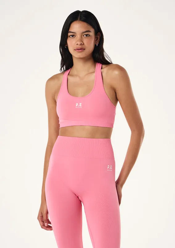 RESTORE SEAMLESS SPORTS BRA IN PINK LEMONADE sold by P.E Nation