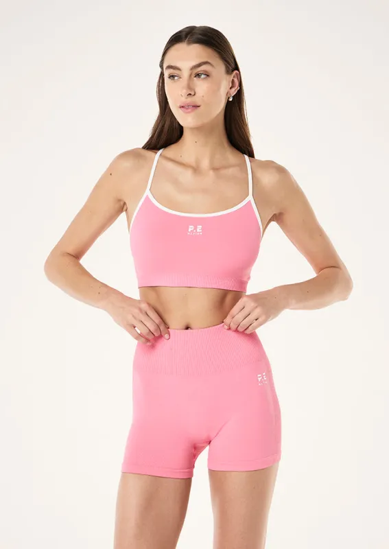 RELEASE SEAMLESS SPORTS BRA IN PINK LEMONADE sold by P.E Nation