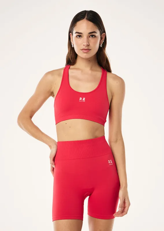 RESTORE SEAMLESS SPORTS BRA IN STRAWBERRY sold by P.E Nation