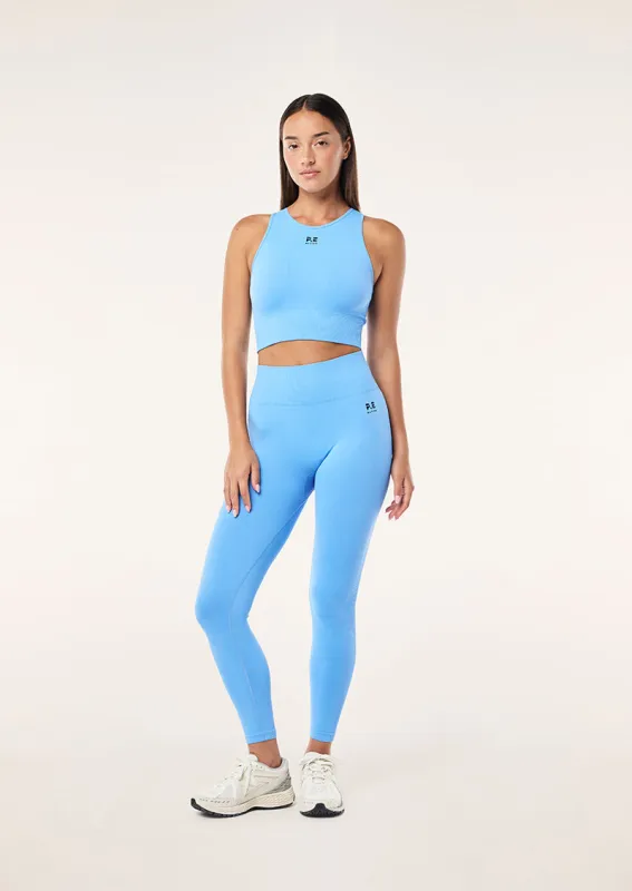RESTORE SEAMLESS LEGGING IN CORNFLOWER BLUE sold by P.E Nation