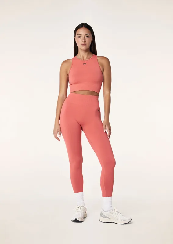 RESTORE SEAMLESS LEGGING IN BRICK RED sold by P.E Nation