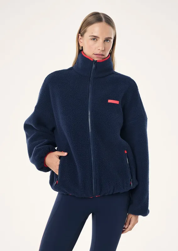 ROTATE SHERPA JACKET IN DARK NAVY & COLLEGE RED made by P.E Nation