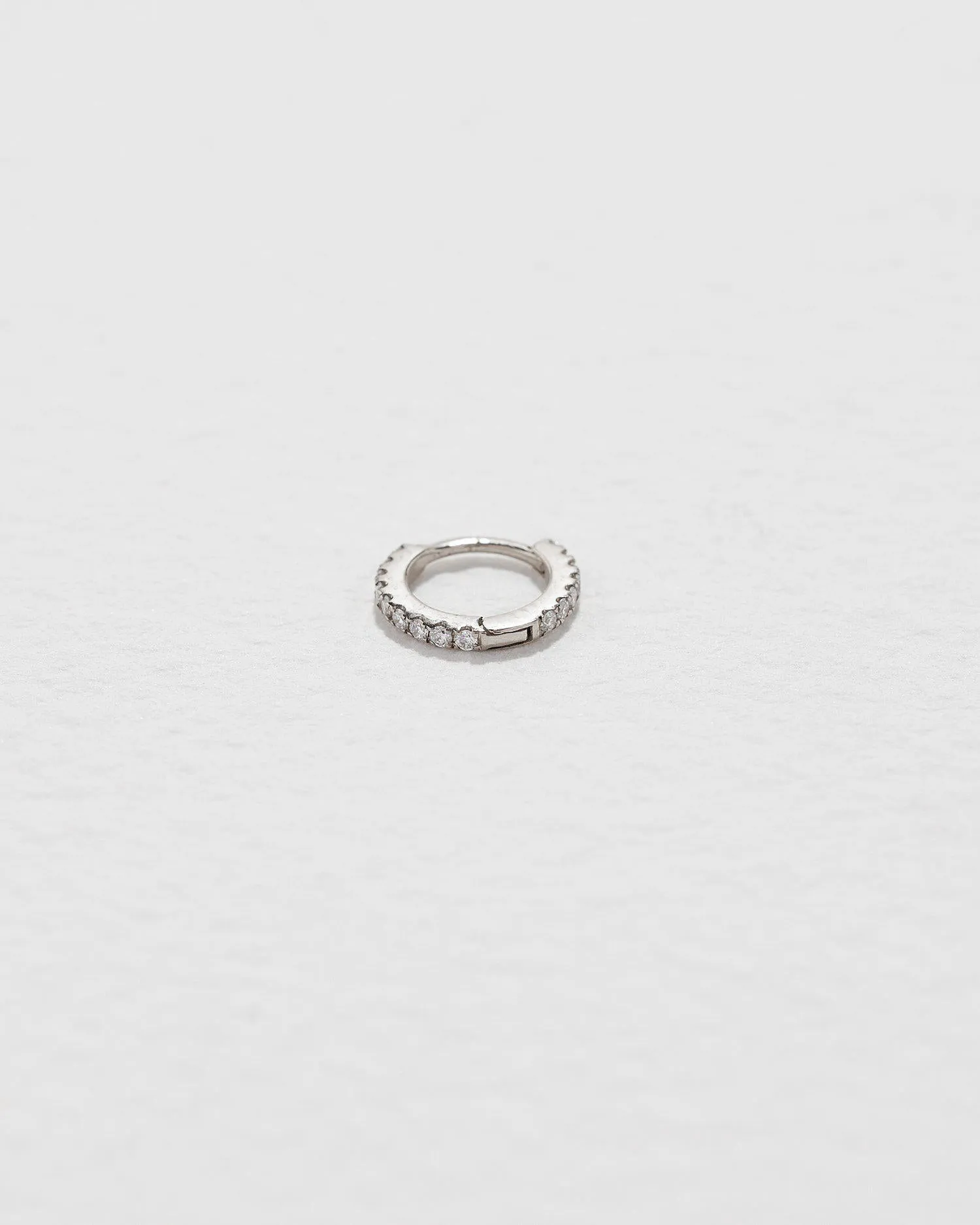 Tiny Full Pavé Huggie sold by Pamela Love