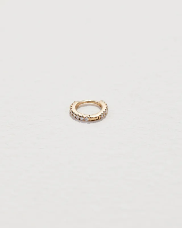 Tiny Full Pavé Huggie sold by Pamela Love