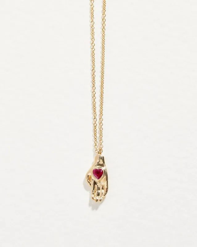 Heart in Hand Pendant sold by Pamela Love