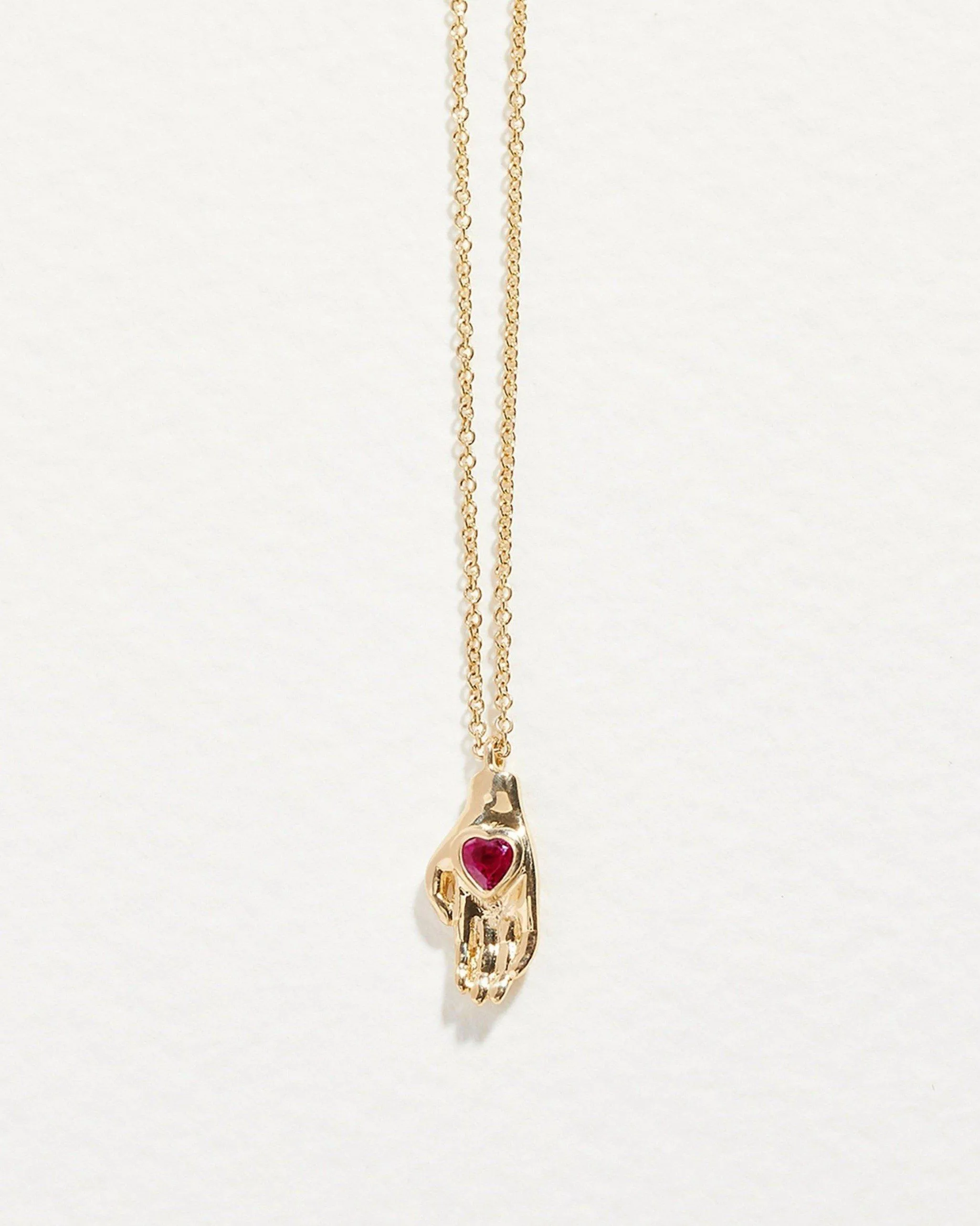 Heart in Hand Pendant sold by Pamela Love