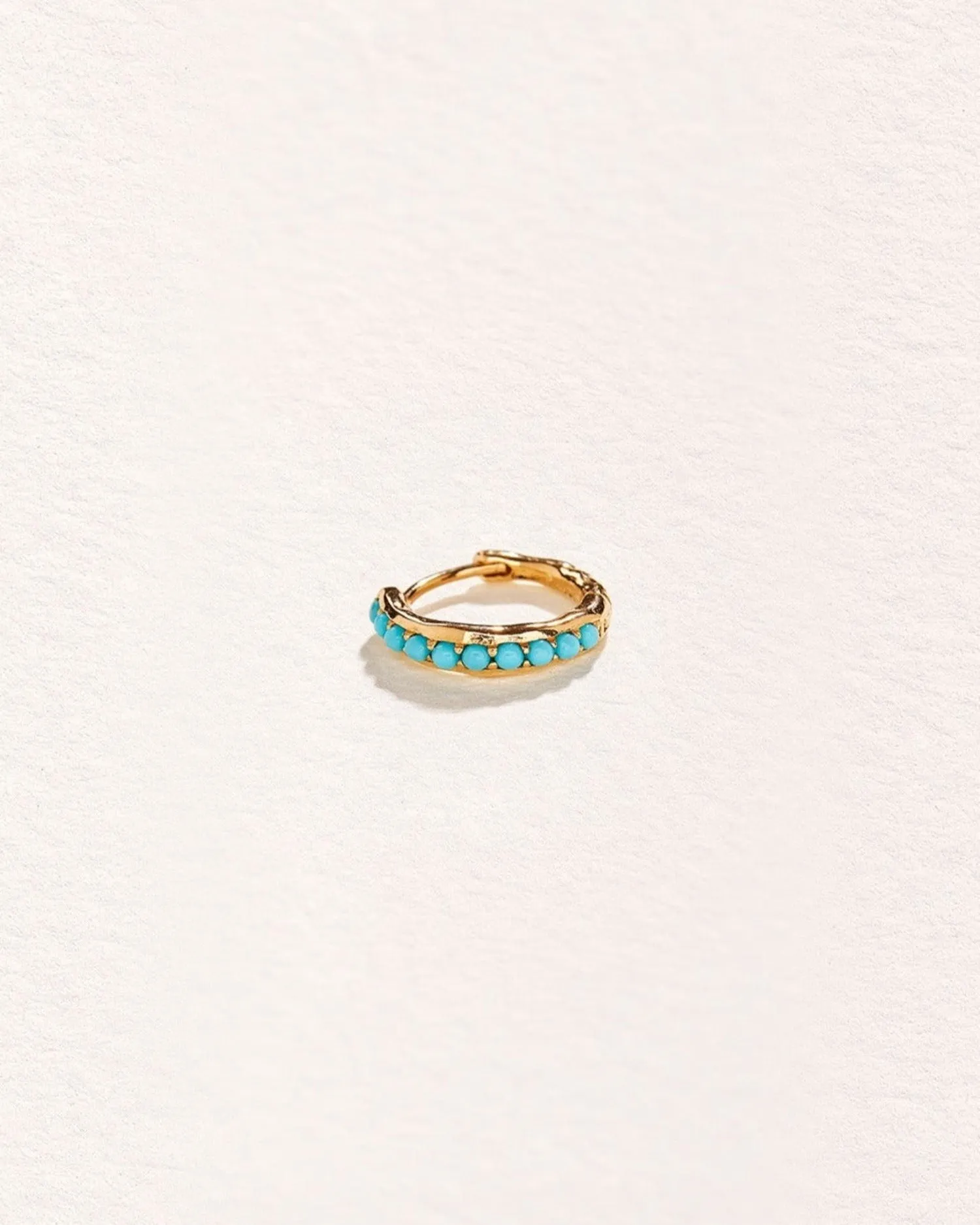 10mm Molten Pavé Huggie sold by Pamela Love