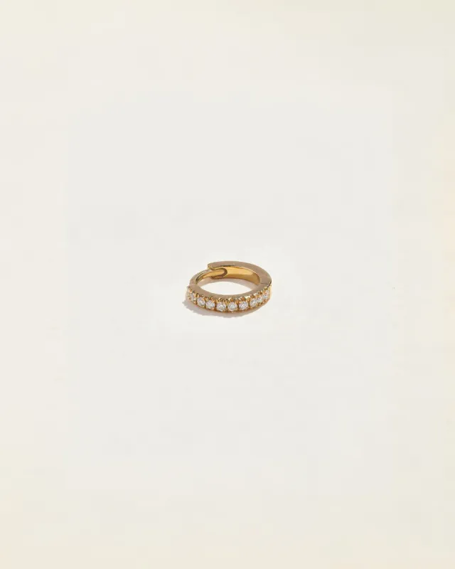 Tiny Half Pavé Huggie sold by Pamela Love