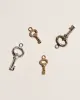 Fini’s Key Charm sold by Pamela Love