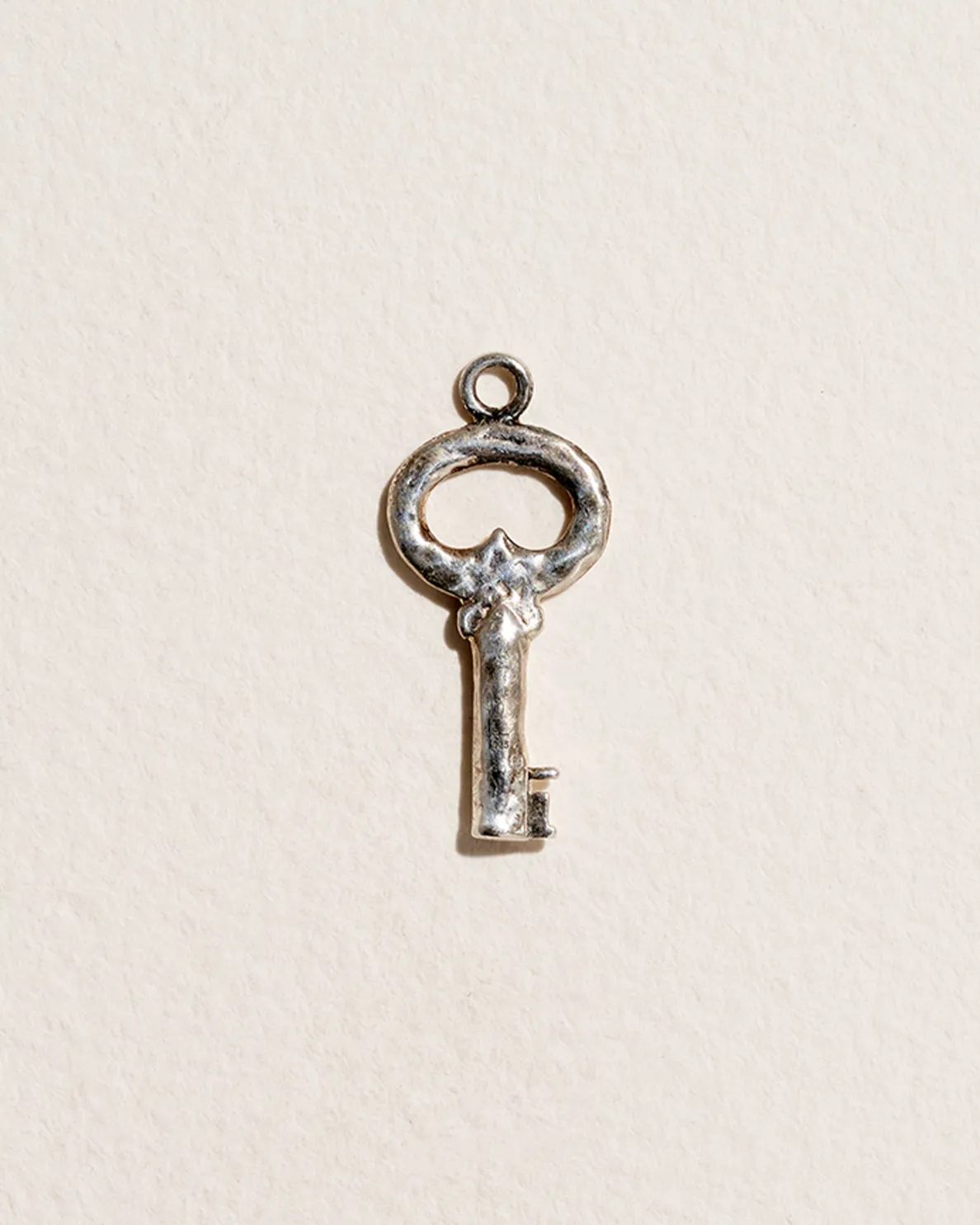 Fini’s Key Charm sold by Pamela Love
